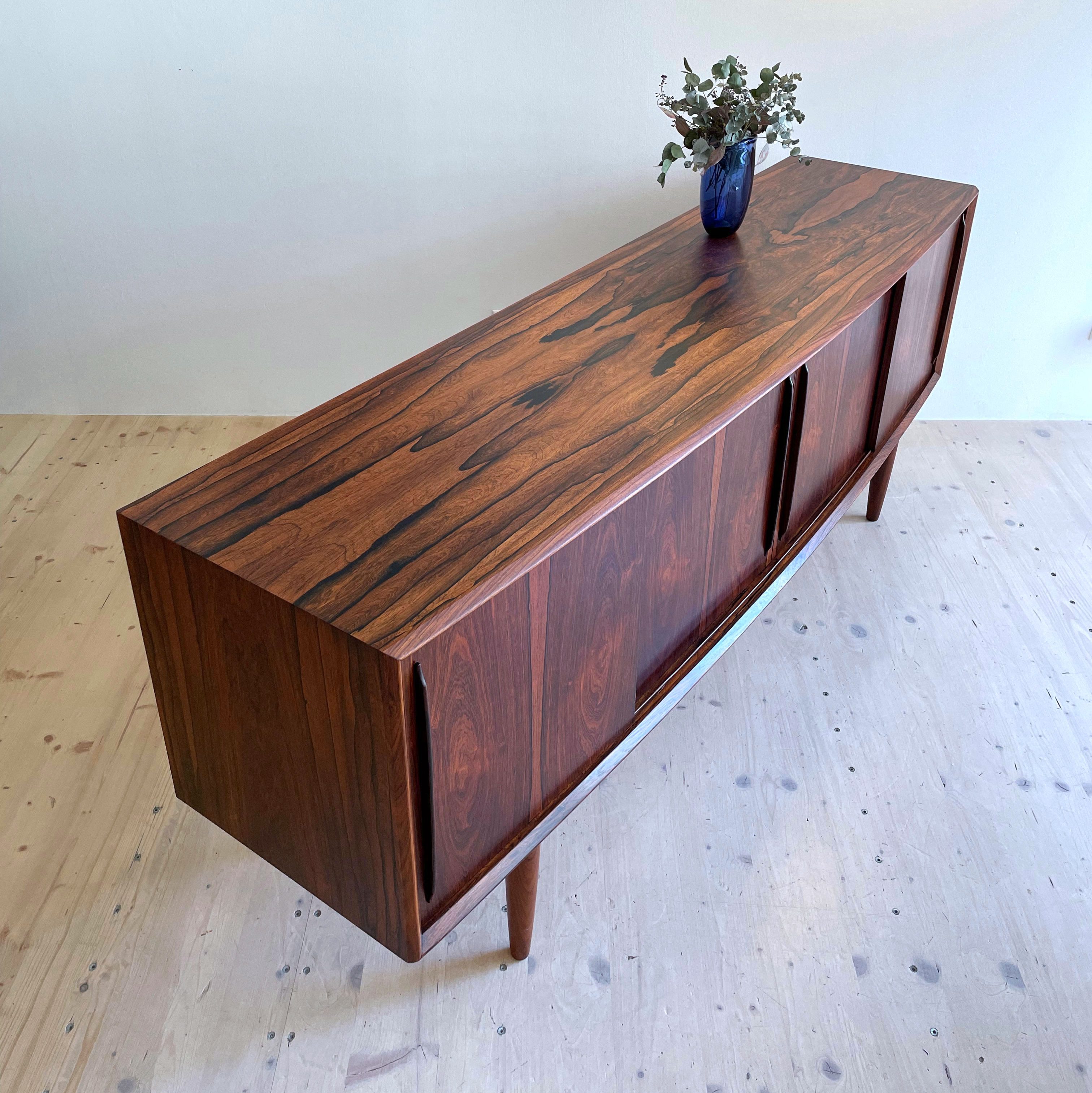 Rosewood Sideboard with Bowed Design. Designed by Svend Aage Madsen for HP Hansen. Made in Denmark, 1960s. Available at heyday möbel, Grubenstrasse 19, 8045 Zürich, Switzerland.