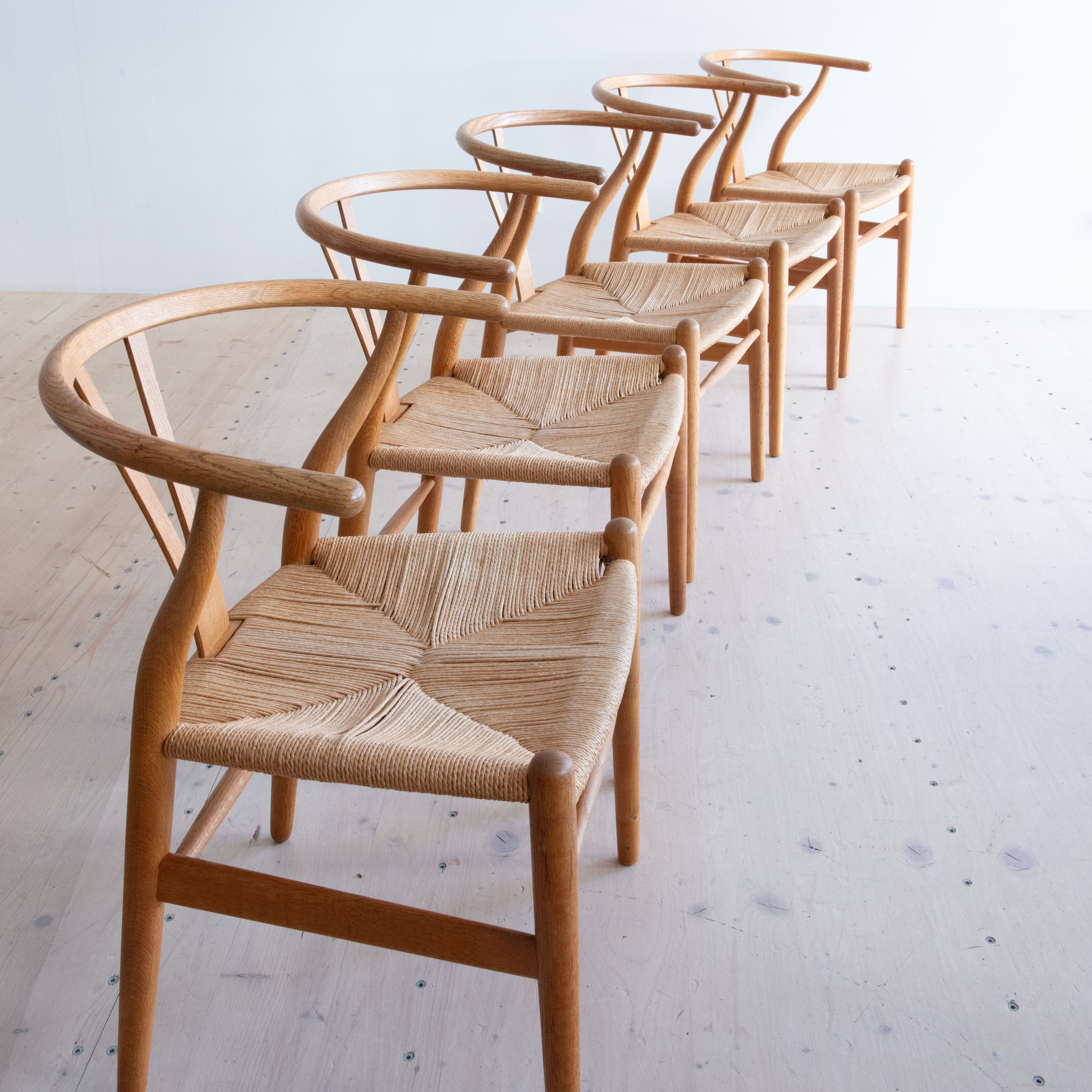 Original CH24 Wishbone Chairs by Hans J. Wegner. Available at heyday möbel, Grubenstrasse 19, 8045 Zürich, Switzerland.
