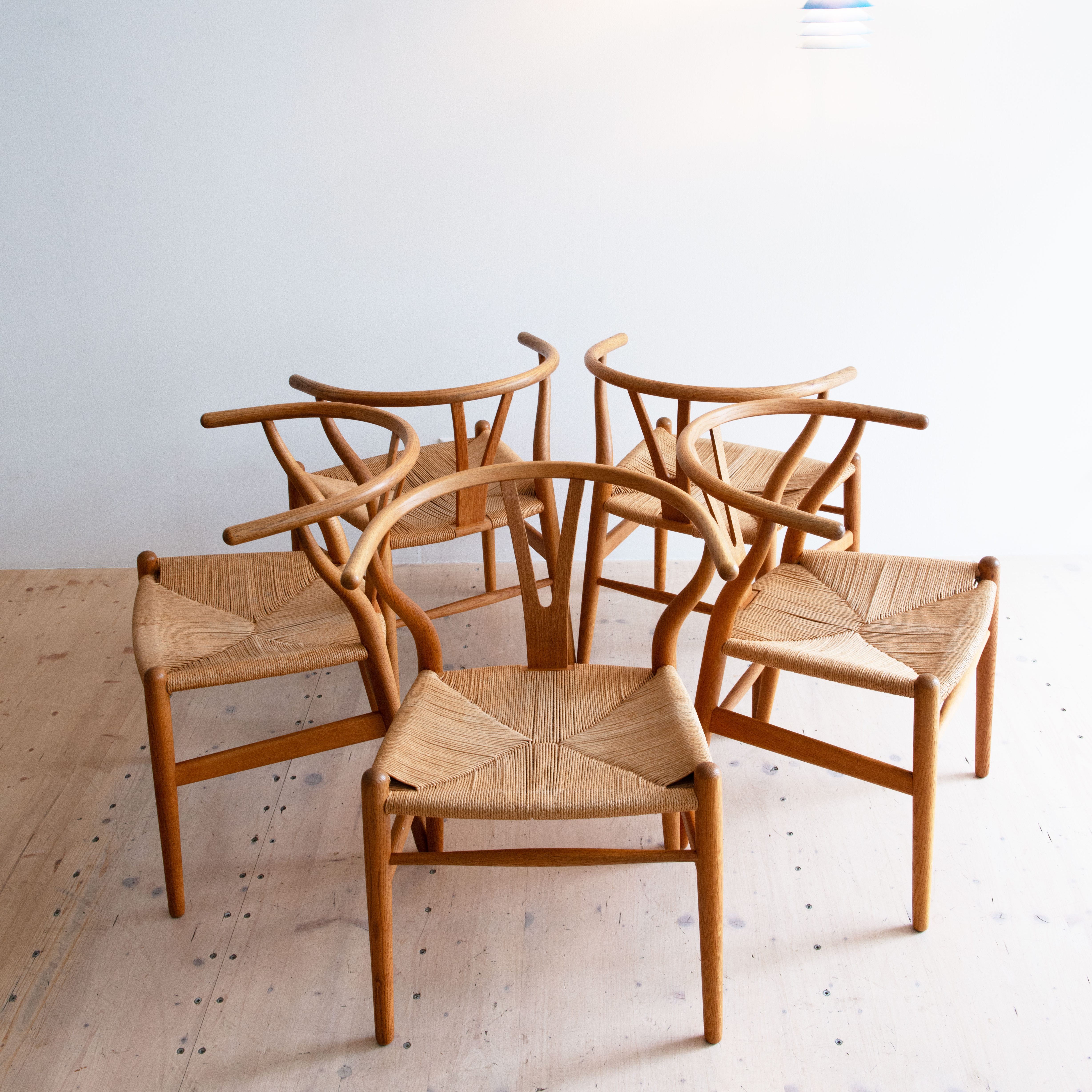 Original CH24 Wishbone Chairs by Hans J. Wegner. Available at heyday möbel, Grubenstrasse 19, 8045 Zürich, Switzerland.