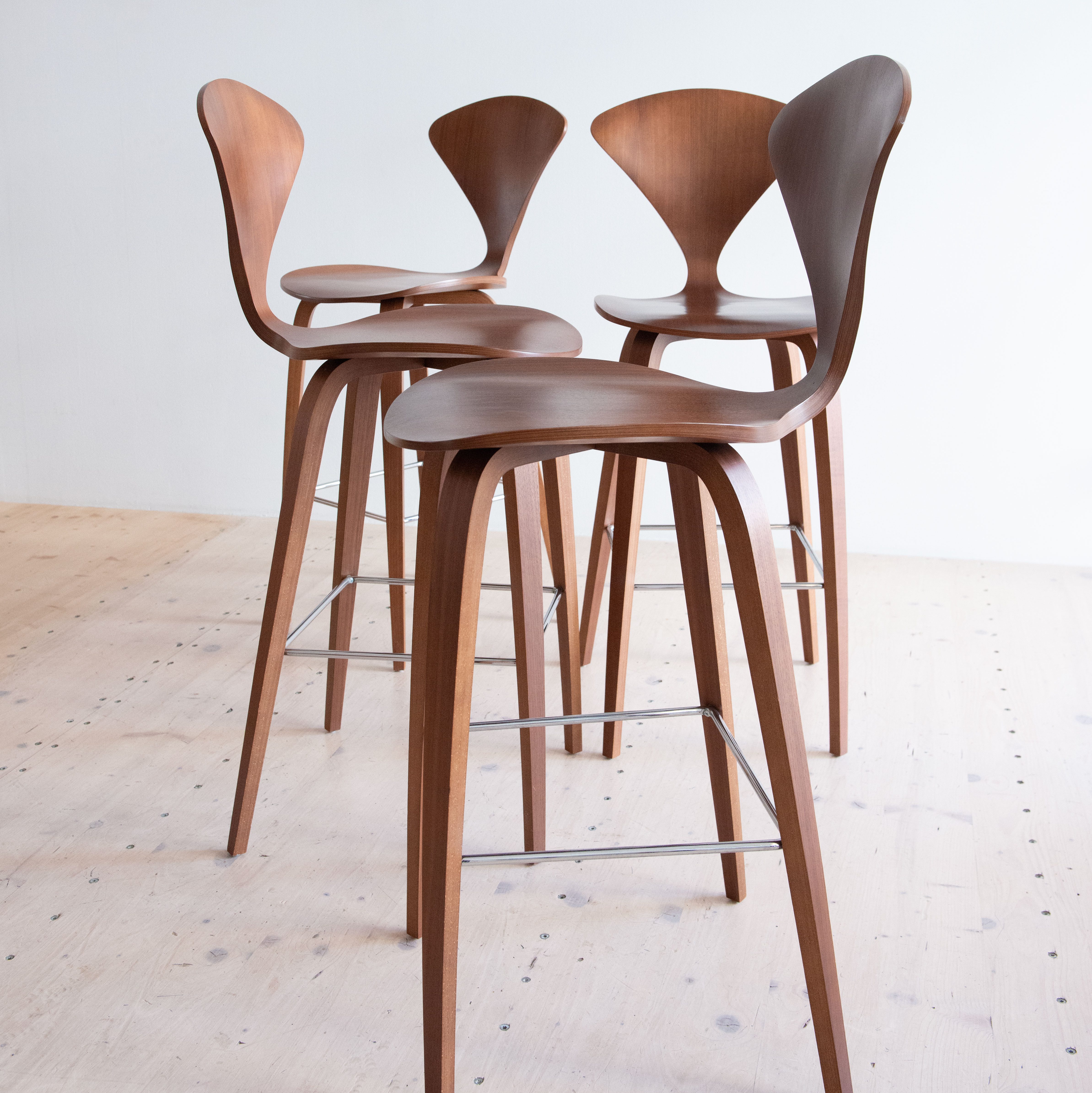 Norman Cherner Bar Stools in Walnut. Bent plywood, designed in the USA, 1958.