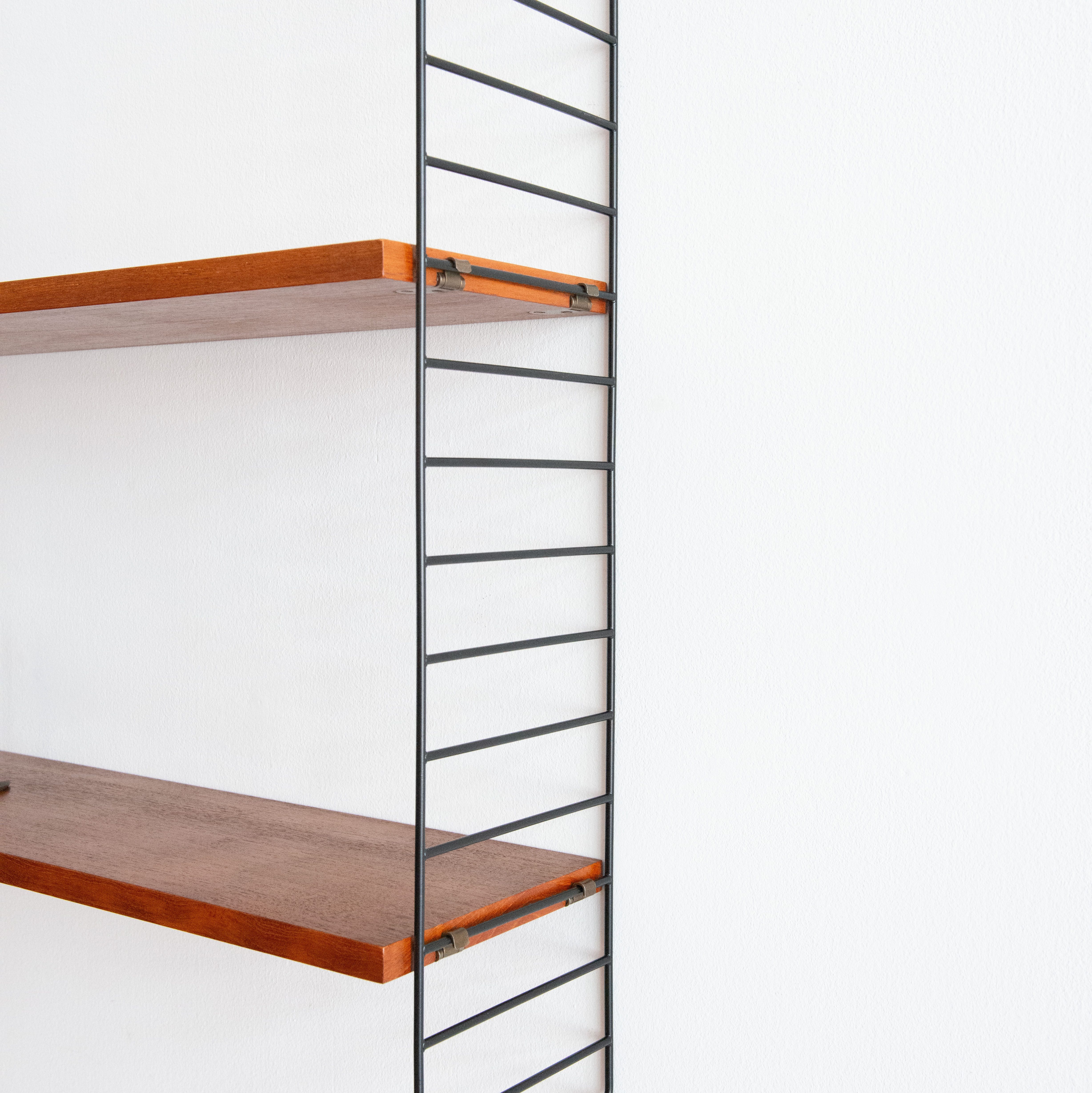 Nisse Strinning Wall Unit in Teak. Available at heyday möbel, Grubenstrasse 19, 8045 Zürich, Switzerland.