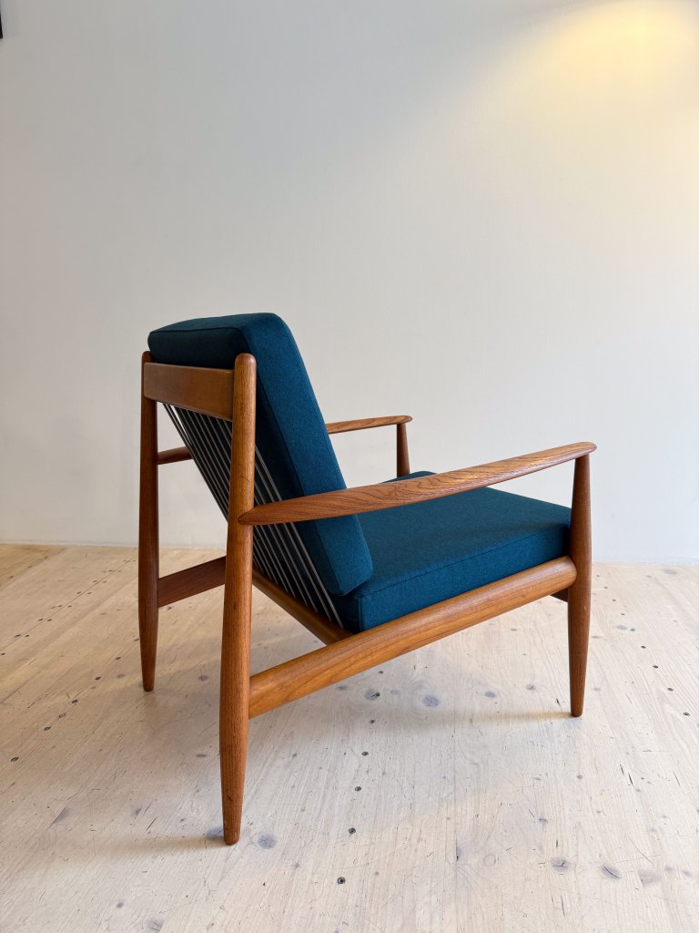 France & Daverkosen Teak Lounge Chair Model 118 by Grete Jalk. Produced in Denmark in the 1950s. Reupholstered with high quality Danish wool in petrol green.
