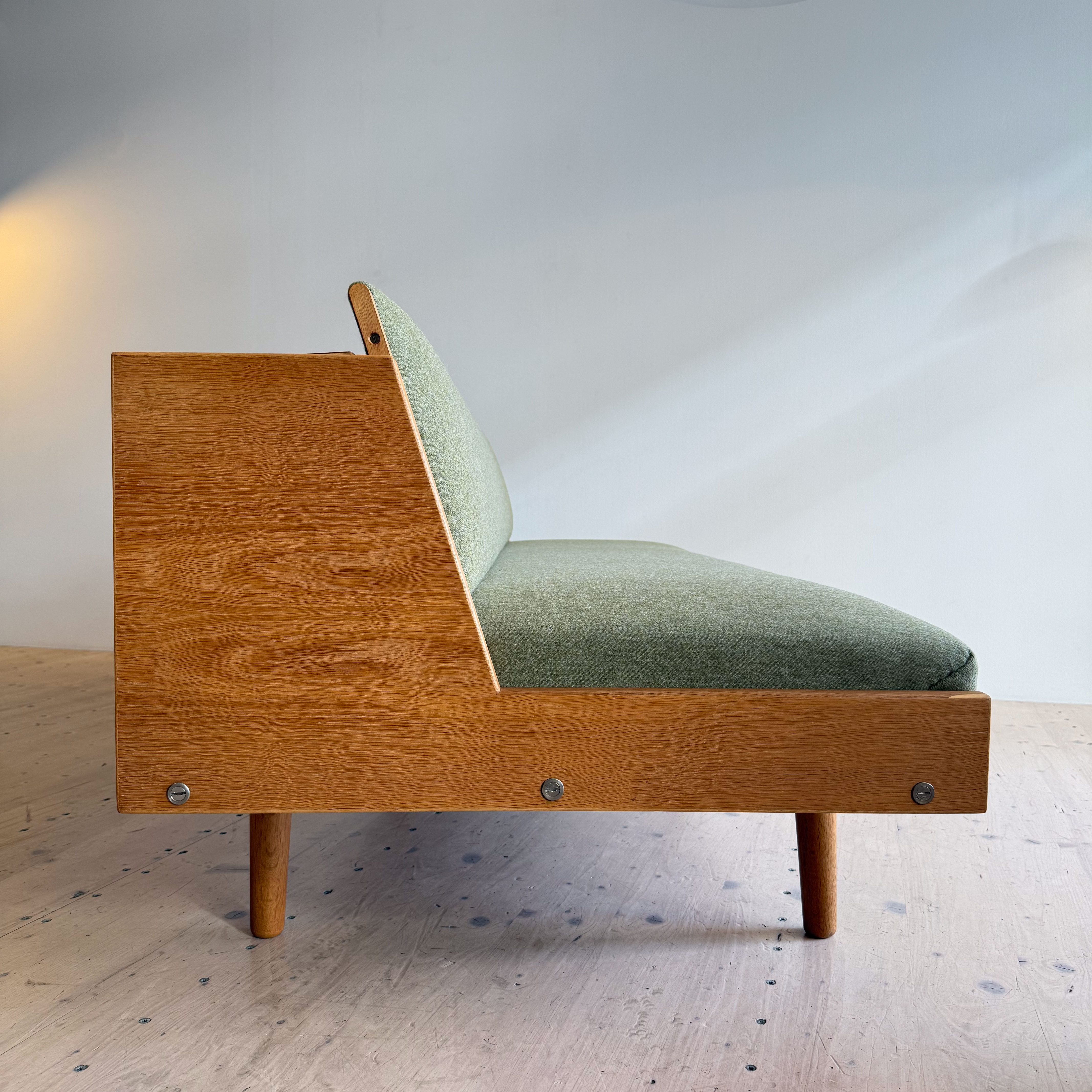 Hans J. Wegner Daybed Sofa in Oak GE-258 by Getama. Made in Denmark in the 1950s. Reupholstered in Olive Green Danish Wool.