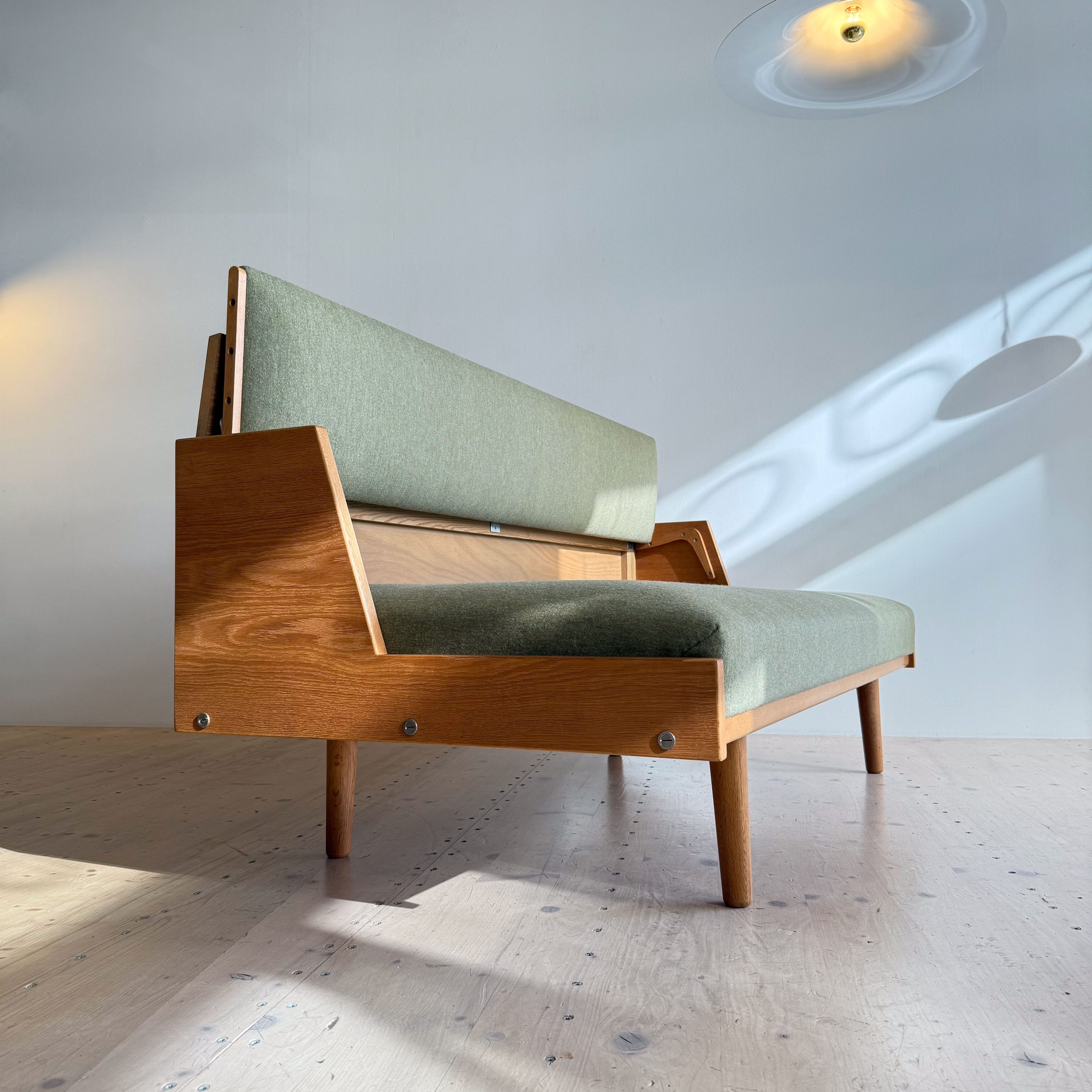 Hans J. Wegner Daybed Sofa in Oak GE-258 by Getama. Made in Denmark in the 1950s. Reupholstered in Olive Green Danish Wool.
