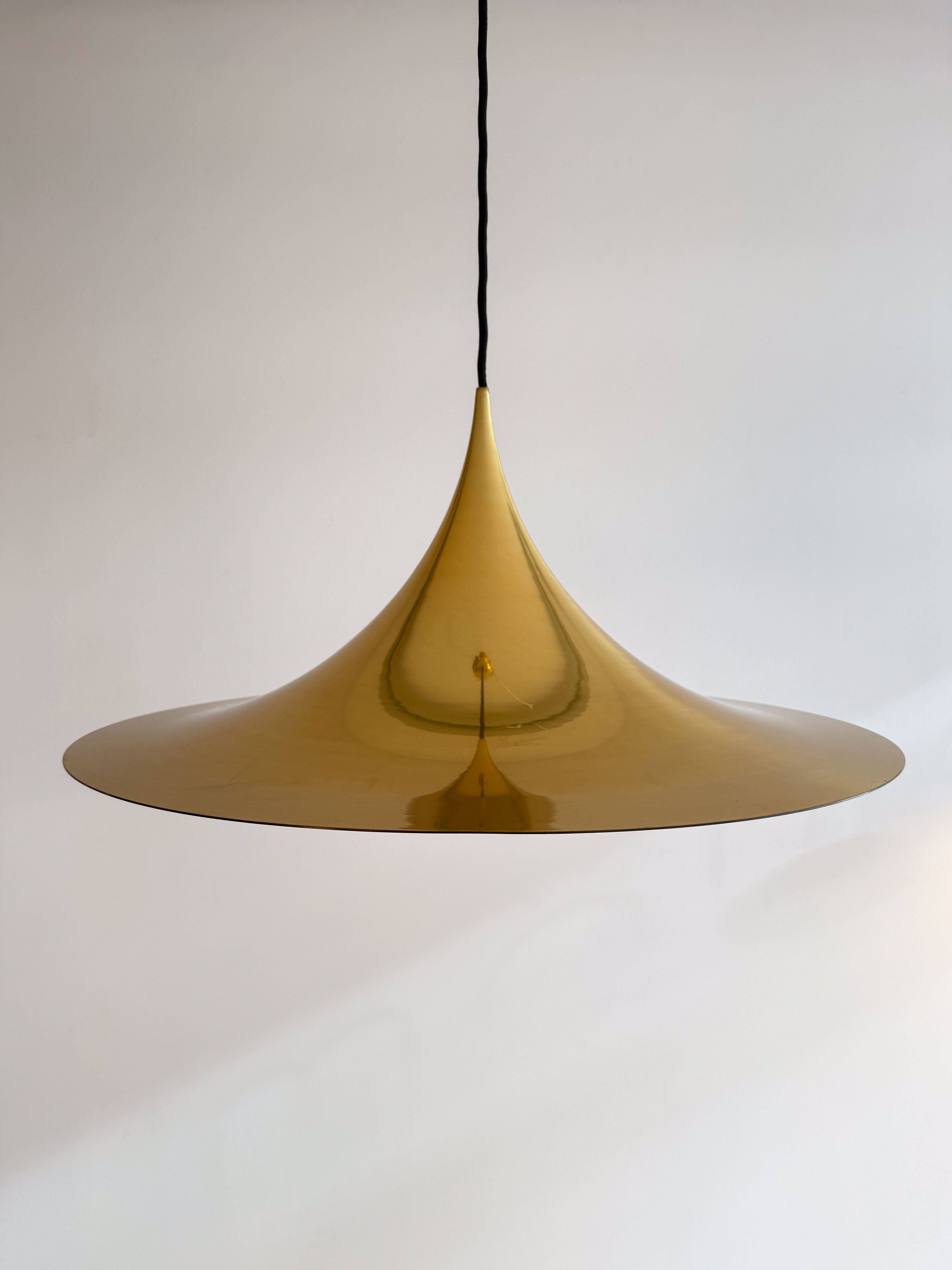 SEMI Pendant Lamp in Gold by Claus Bonderup and Torsten Thorup. Available at heyday möbel, Grubenstrasse 19, 8045 Zürich.