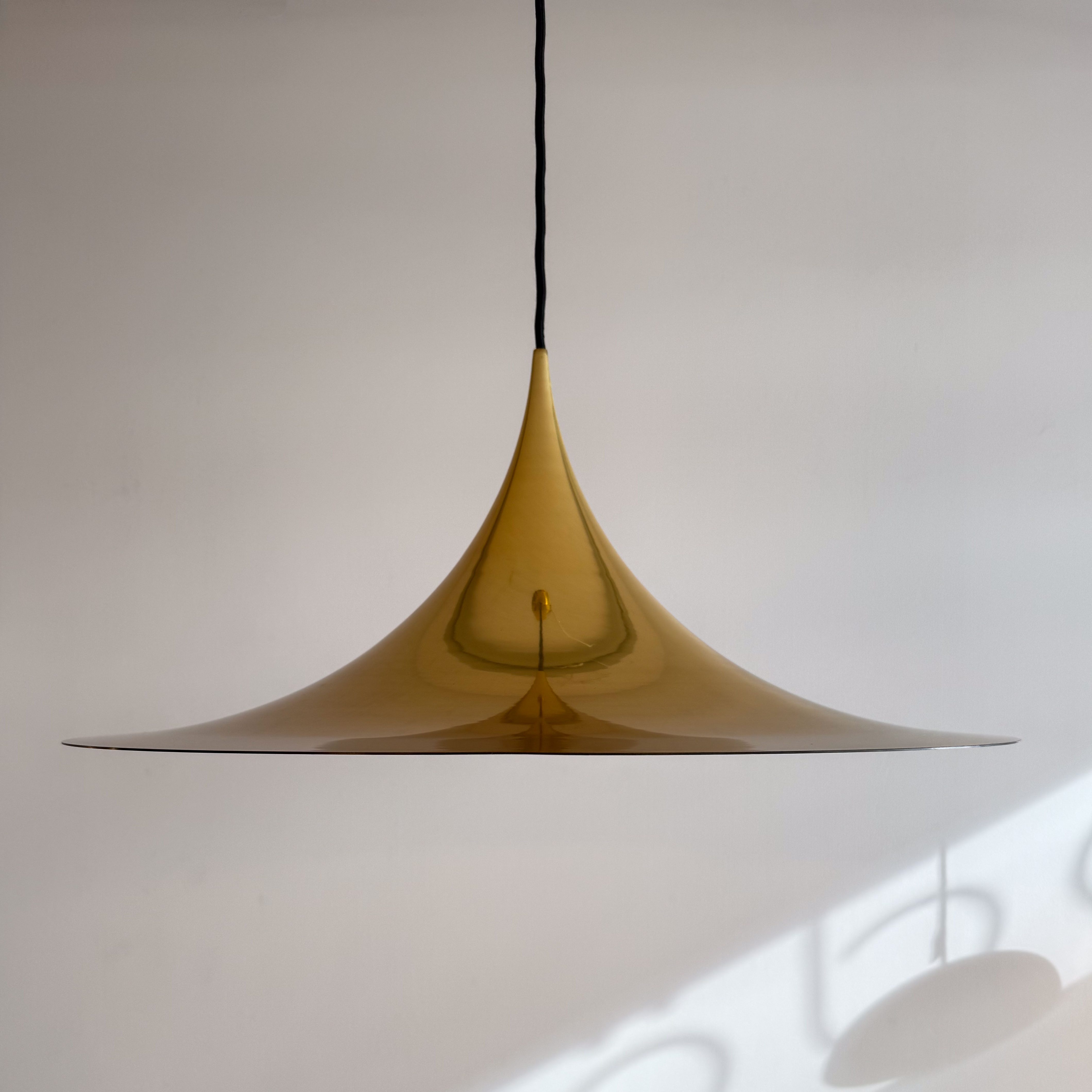 SEMI Pendant Lamp in Gold by Claus Bonderup and Torsten Thorup. Available at heyday möbel, Grubenstrasse 19, 8045 Zürich.