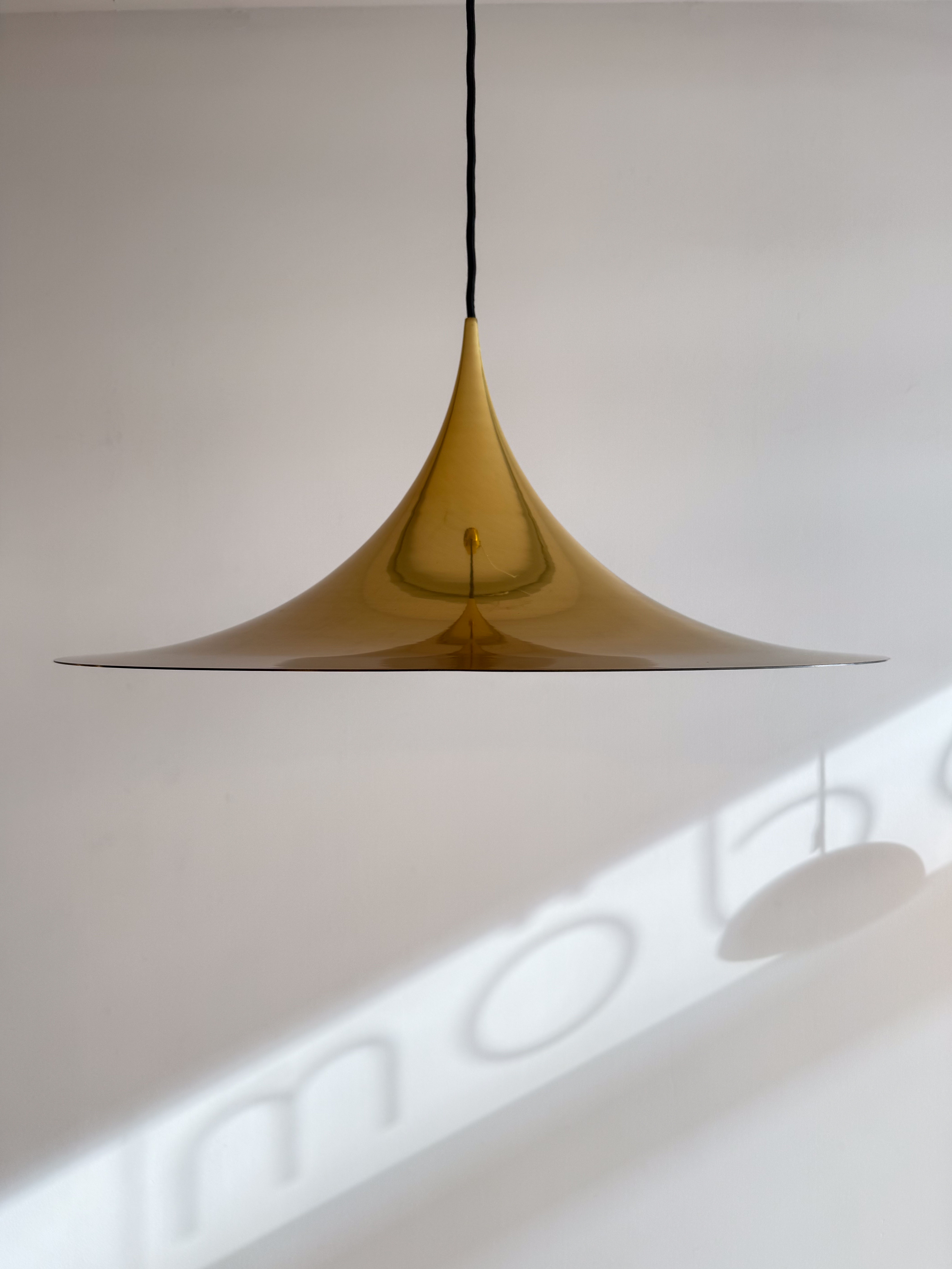 SEMI Pendant Lamp in Gold by Claus Bonderup and Torsten Thorup. Available at heyday möbel, Grubenstrasse 19, 8045 Zürich.
