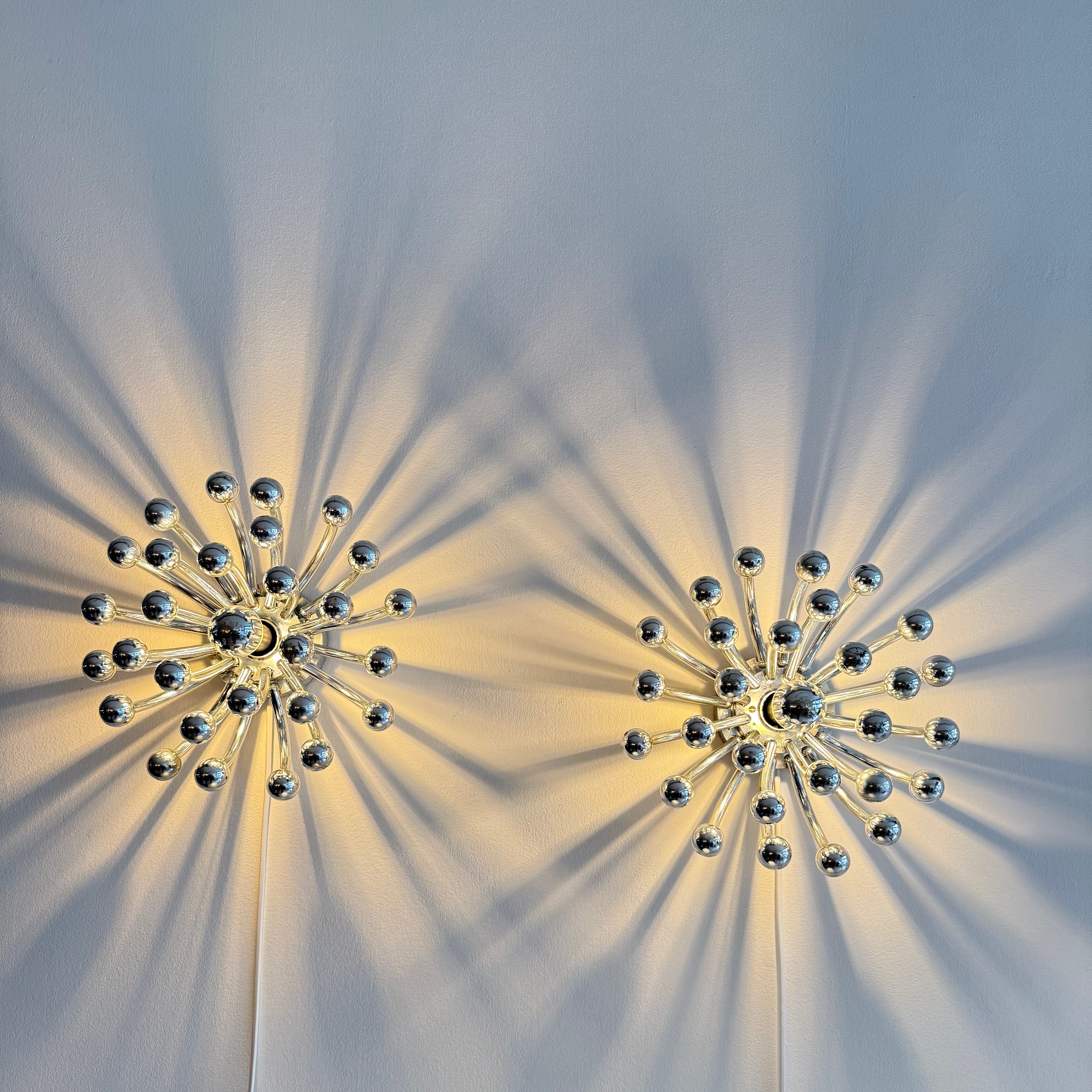 Pair of Chrome Pistillo Lamps by Studio Tetrach. Produced by Valenti Luce. Available at heyday möbel, Grubenstrasse 19, 8045 Zürich.