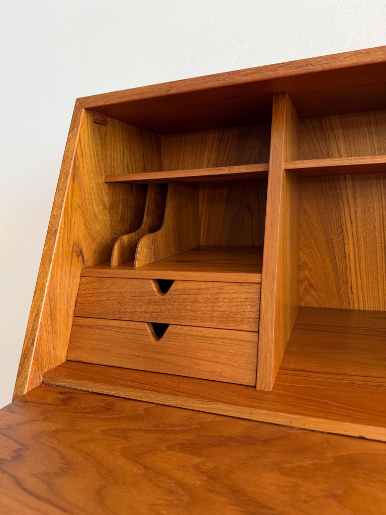 Close-up of the interior compartments and drawers of an Arne Wahl Iversen teak secretary, showcasing its elegant design and craftsmanship.